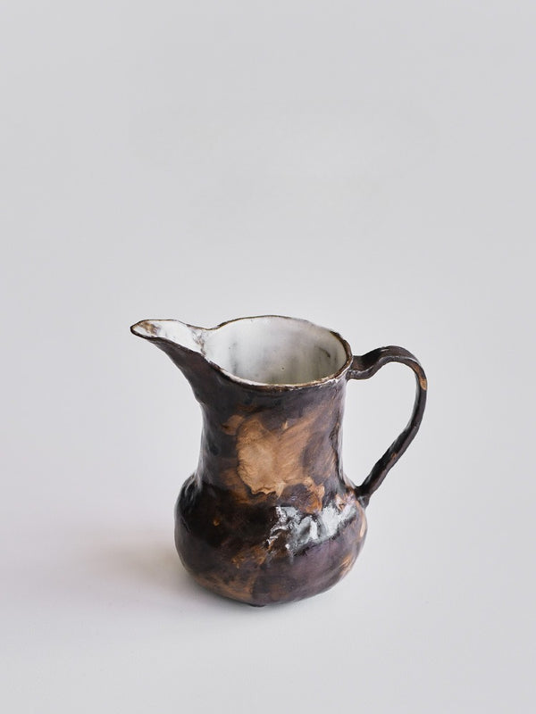 Small handmade stoneware jug for milk